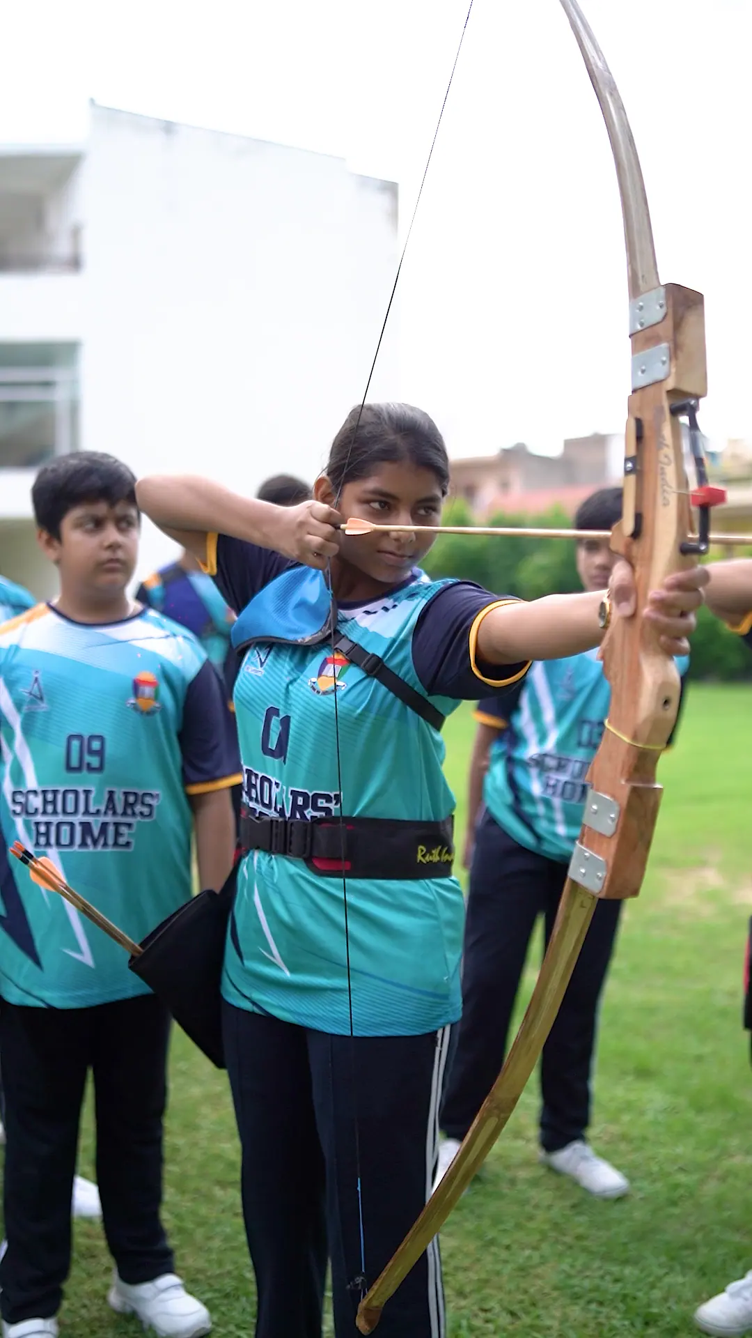 A Scholars' Home archer drawing her bow